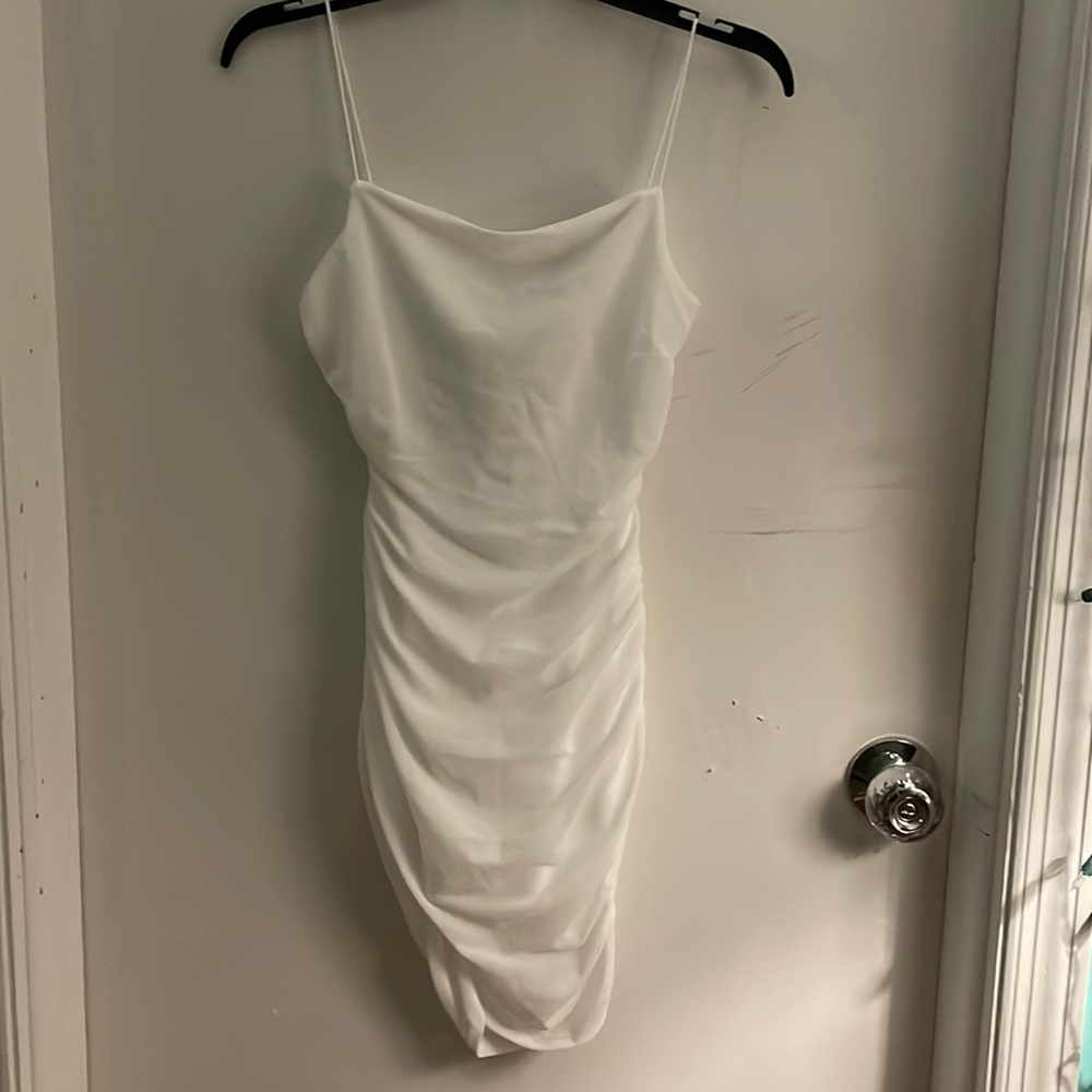 Brand new never worn!! Slim fit white dress VERY flattering